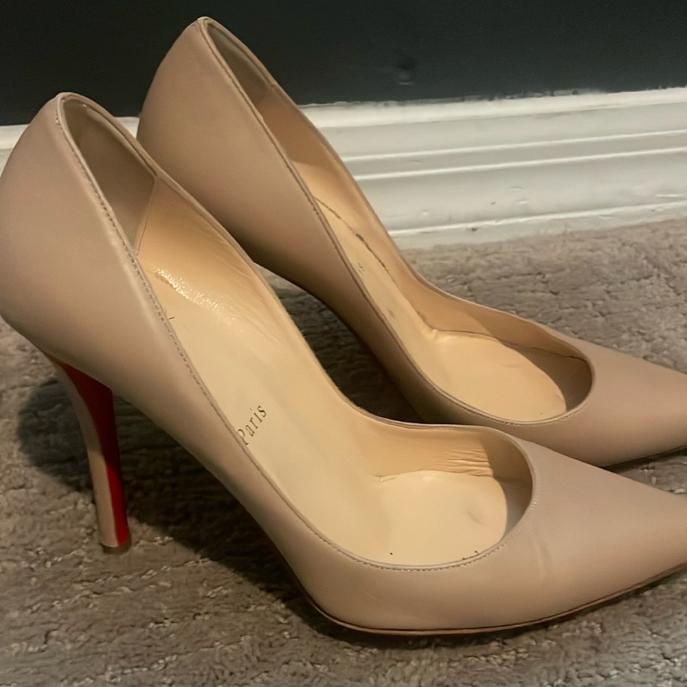Christian Louboutin tan heels with red soles